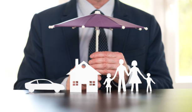 General agent protecting a family, a house and a car with his hands